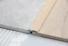Afslutningsprofil, Multiflex t/dørtrin Hvid Eg - LAV 8-12 mm. 